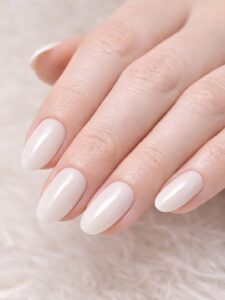 Minimal winter nails with pearly shimmer on short almond nails, glossy milky nude finish, Blissful Beauty Nail Lounge San Diego 
