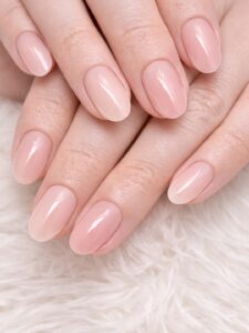 Minimal winter nails on short oval nails with glossy sheer nude pink polish, clean girl manicure style, soft milky finish, Blissful Beauty Nail Lounge San Diego