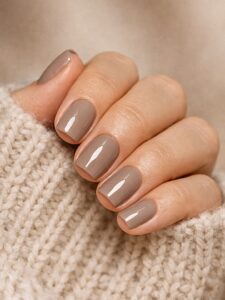 Minimal winter nails in glossy taupe neutral polish on short square nails, cozy winter manicure, San Diego