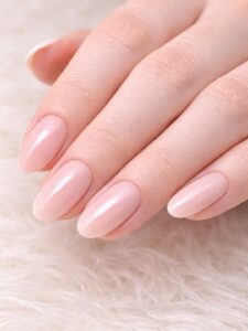 Minimal winter nails with glossy sheer pink on short almond nails, clean cuticles and natural finish, Blissful Beauty Nail Lounge San Diego