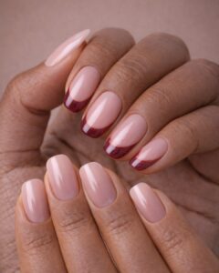 February nails with soft pink shimmer and iridescent heart embellishments