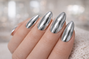 Chrome mirror silver almond nails with reflective metallic finish March Nail Trends at Blissful Beauty Nail Lounge San Diego
