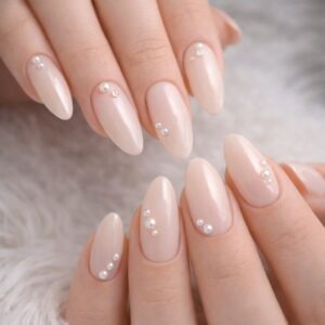 Glossy nude almond nails with pearl embellishments, International Women’s Day Nails at Blissful Beauty Nail Lounge