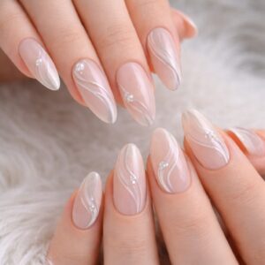 Sheer nude almond nails with white wave lines and crystal accents, International Women’s Day Nails Blissful Beauty Nail Lounge